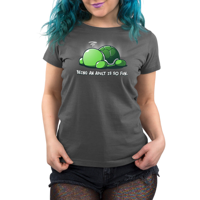 Premium Cotton T-shirt_TeeTurtle Being an Adult is So Fun Charcoal Gray t-shirt featuring a cartoon turtle lying face down with a stressed expression, accompanied by the text "Being an adult is so fun."