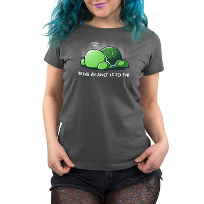 Premium Cotton T-shirt_TeeTurtle Being an Adult is So Fun Charcoal Gray t-shirt featuring a cartoon turtle lying face down with a stressed expression, accompanied by the text "Being an adult is so fun."