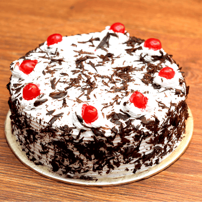 For Tenderness - Black forest cake and Chrysanthemums - Same Day Delivery - TCS SentimentsExpress