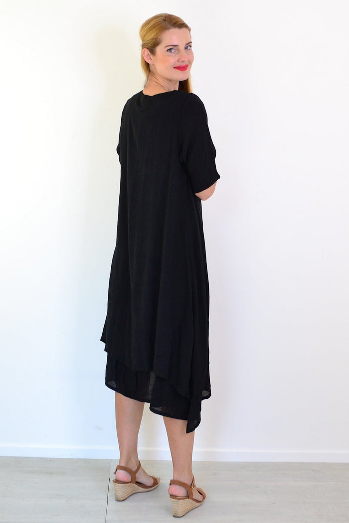 Black summer tunic dress by La Mode, featuring lightweight fabric, relaxed fit, and stylish short sleeves.