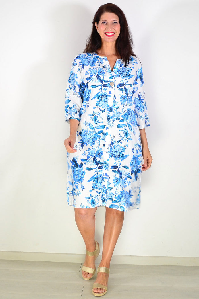 Blue floral linen blend tunic by La Mode, featuring a relaxed fit with vibrant floral patterns and lightweight breathable fabric.