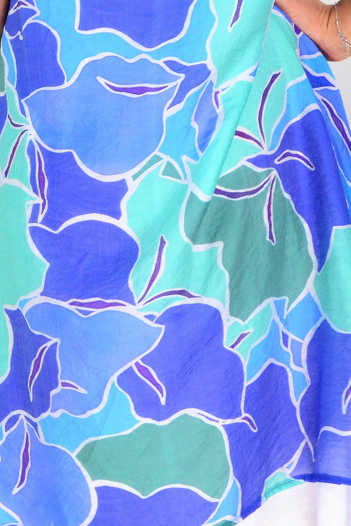 Blue and green summer tunic dress by La Mode, featuring lightweight fabric and casual fit, displayed on a hanger.