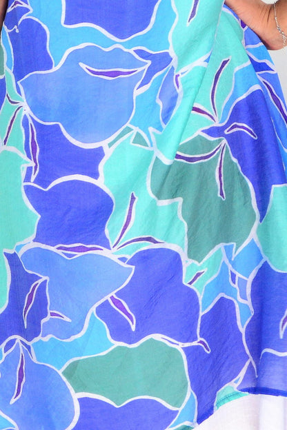 Blue and green summer tunic dress by La Mode, featuring lightweight fabric and casual fit, displayed on a hanger.