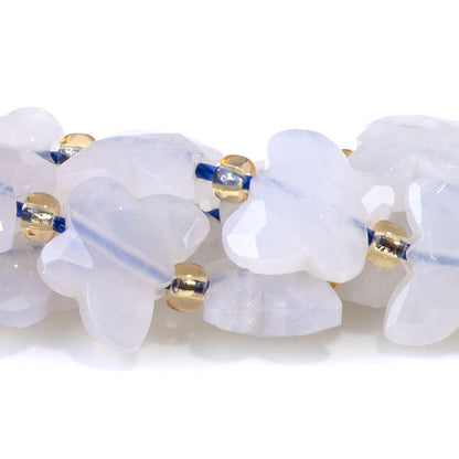 This is a Dakota Stones 10x8mm Blue Rose Quartz Butterfly Gemstone strand with faceted beads in 15-16 inch strand.