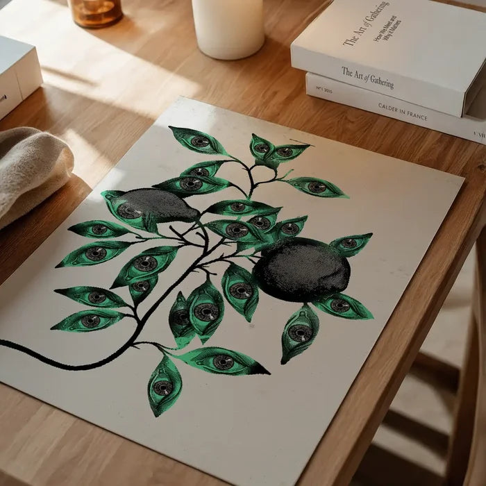Striking Botanical Eyes graphic print on archival art paper, featuring green leaves with eyes and dark fruit.