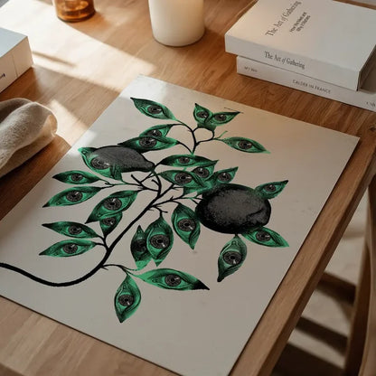 Striking Botanical Eyes graphic print on archival art paper, featuring green leaves with eyes and dark fruit.