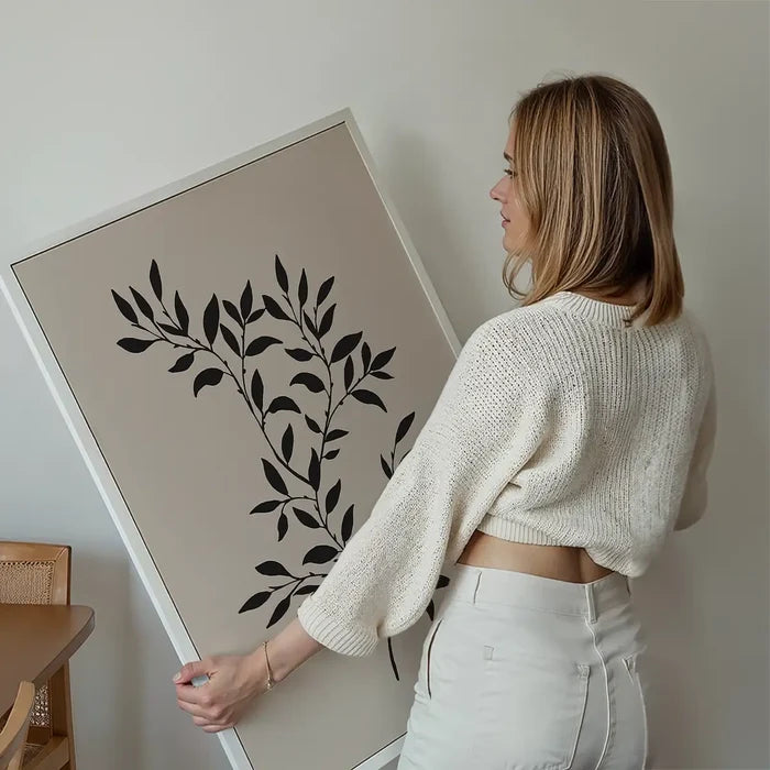 Branch Silhouette Print 1 held up against a living room wall