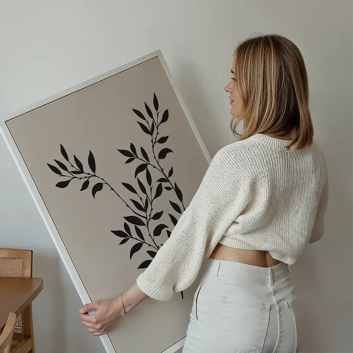 Branch Silhouette Print 2 held up against a living room wall