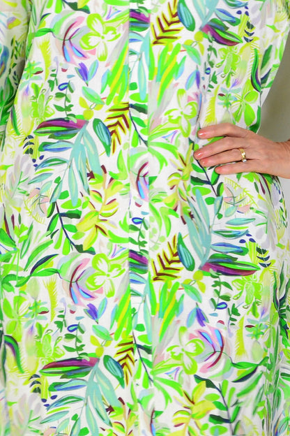 Bright light green floral linen blend tunic by La Mode, showing flowing fabric and floral pattern on a casual, stylish garment.
