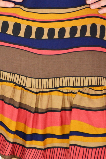 Brown swirls patterned Hourglass tunic dress displayed on a hanger, showcasing its flowing fabric and stylish design.