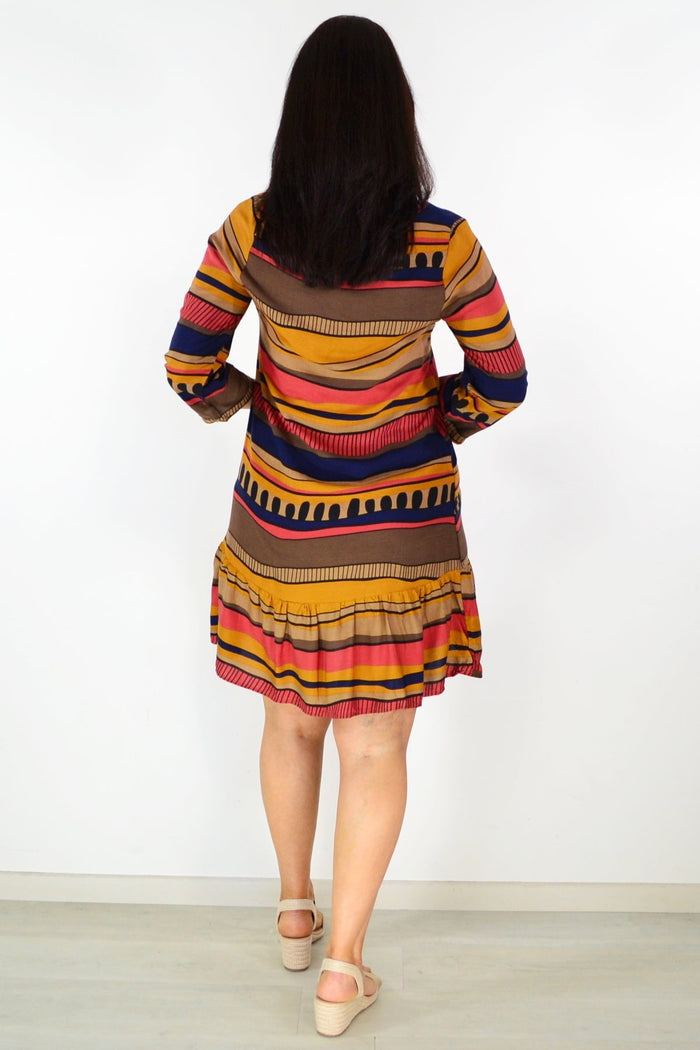 Brown swirls patterned tunic dress by Hourglass featuring a relaxed fit and flowing fabric, displayed on a hanger.