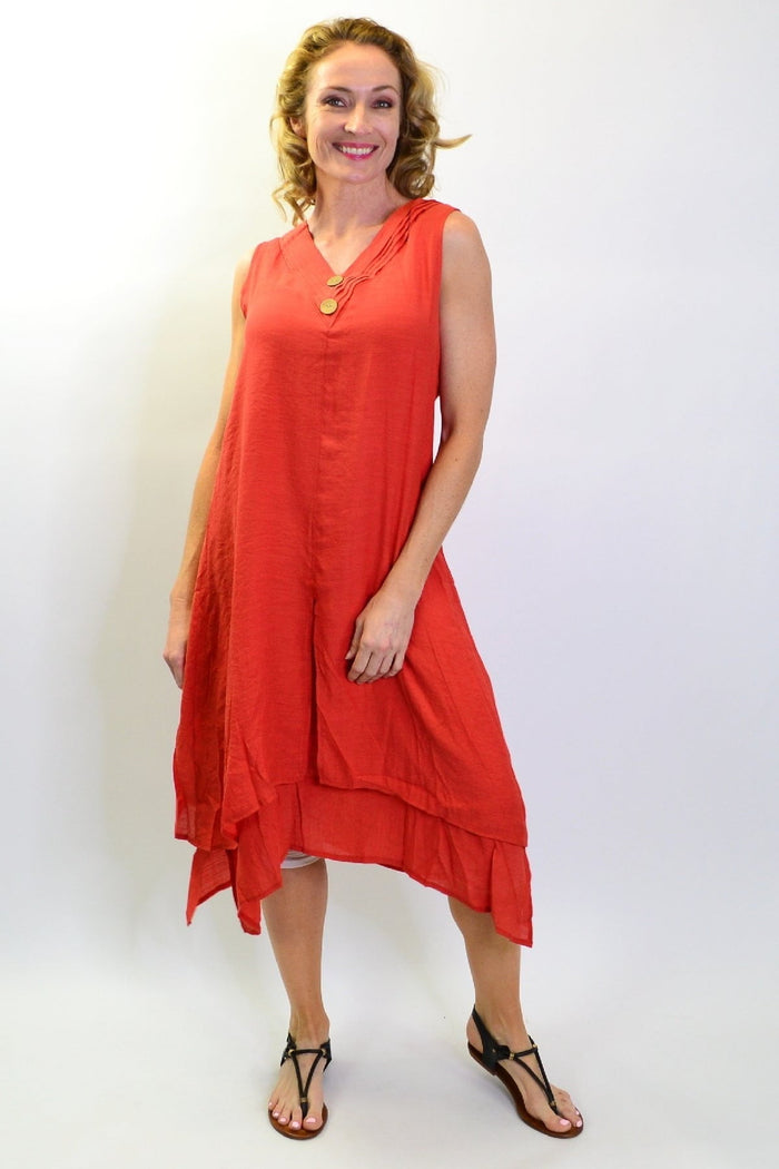 Burnt orange sleeveless button tunic dress by La Mode, featuring a relaxed fit and stylish design, hanging on a mannequin.