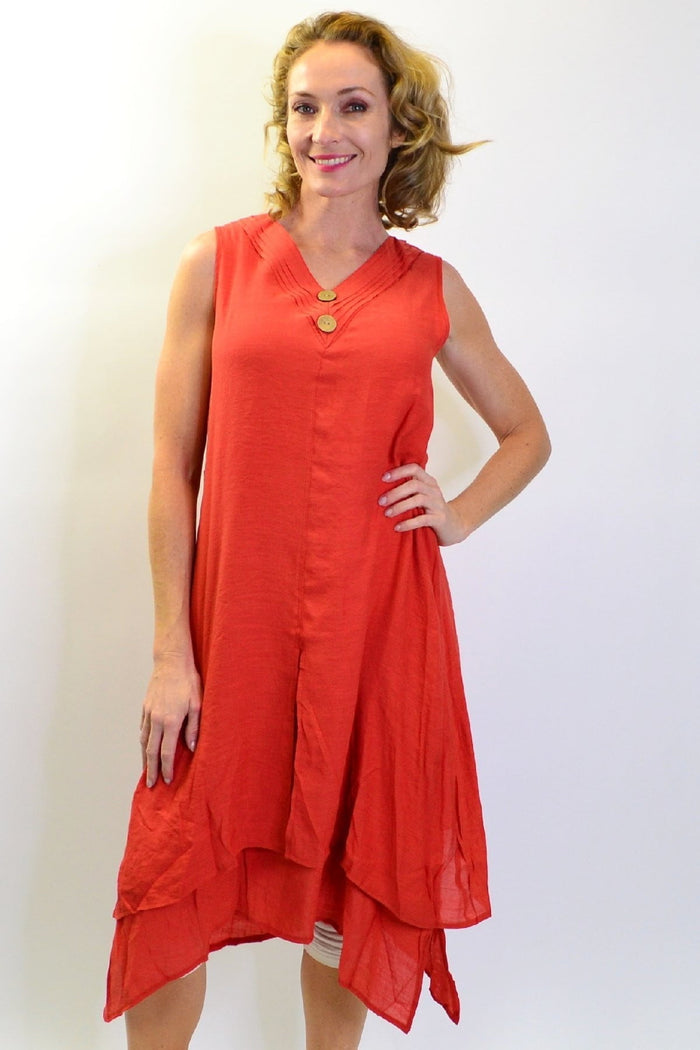 Burnt orange sleeveless button tunic dress by La Mode, shown hanging on a hanger with a simple background.