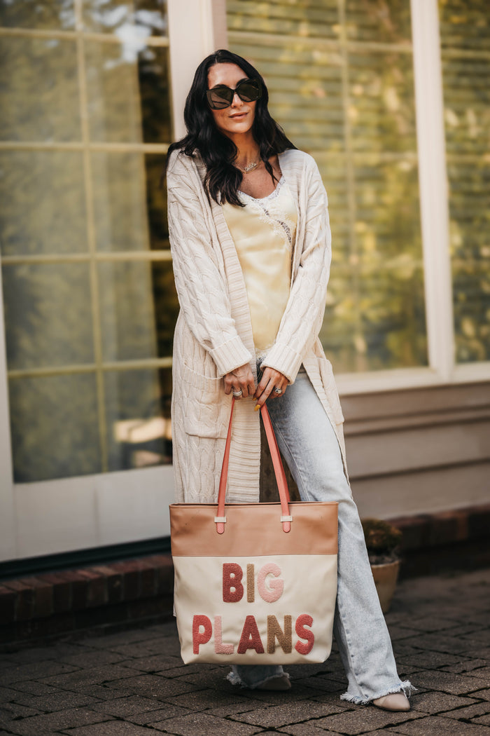 Women's cream cable knit cardigan long on model