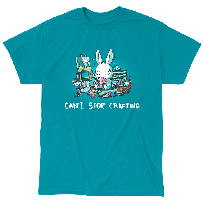 Classic Cotton T-shirt_TeeTurtle Can't. Stop. Crafting. tropical blue t-shirt featuring an illustration of a white rabbit with large, expressive eyes, and sweat droplets coming from its head sewing a small pink bunny surrounded by crafting materials like balls of yarn in a woven basket, paint pallets and brushes,  origami birds and other shapes, sewing thread, small stuffed animals, books stacked high, craft knives, and other crafting supplies, with the text "CAN'T. STOP. CRAFTING." at the botto