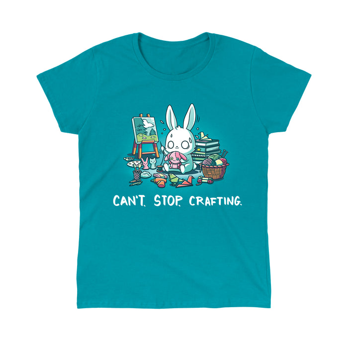 Classic Cotton T-shirt_TeeTurtle Can't. Stop. Crafting. tropical blue t-shirt featuring an illustration of a white rabbit with large, expressive eyes, and sweat droplets coming from its head sewing a small pink bunny surrounded by crafting materials like balls of yarn in a woven basket, paint pallets and brushes,  origami birds and other shapes, sewing thread, small stuffed animals, books stacked high, craft knives, and other crafting supplies, with the text "CAN'T. STOP. CRAFTING." at the botto