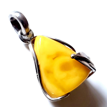 Classic small butterscotch amber pendant in sterling silver frame