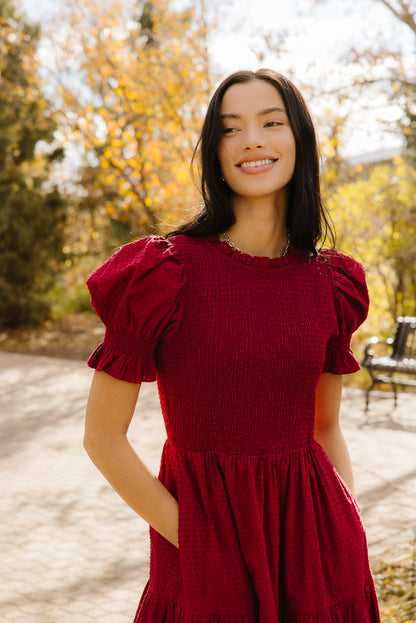 Woman in red dress outside