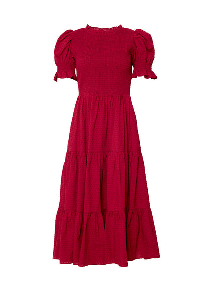 Red dress in front of a white background