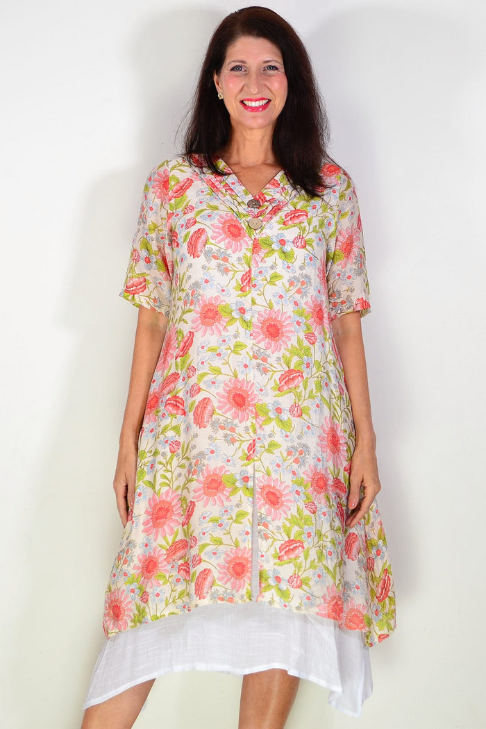 Cream flower print summer tunic dress by La Mode, featuring a floral pattern and lightweight fabric, shown on a hanger.