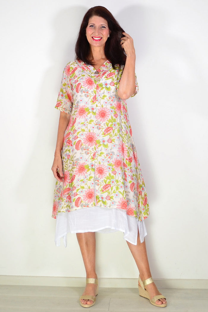Cream flower print summer tunic dress by La Mode, featuring lightweight fabric and floral pattern, displayed on a hanger.