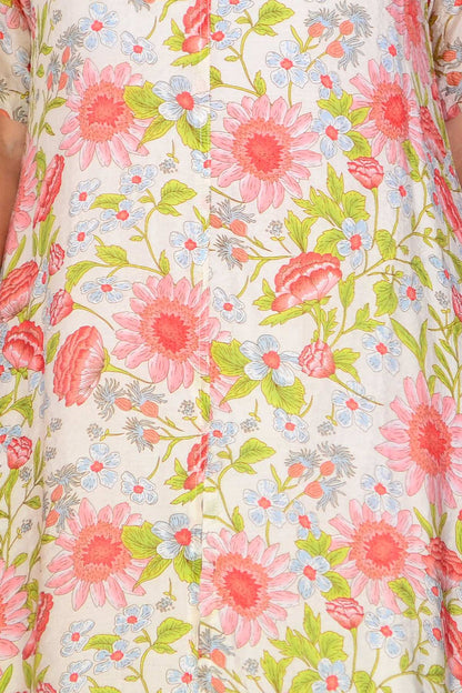 Cream flower print summer tunic dress by La Mode, featuring a lightweight fabric and floral design perfect for warm weather.