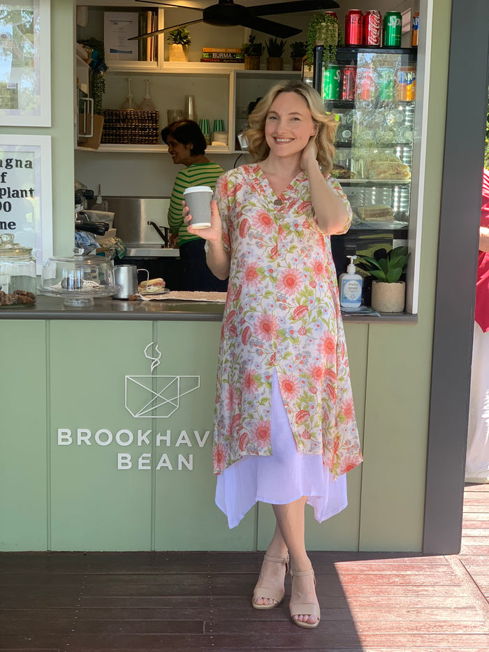 Cream summer tunic dress with floral print from La Mode, featuring a relaxed fit and lightweight fabric.
