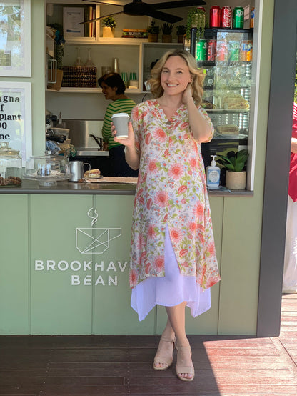 Cream summer tunic dress with floral print from La Mode, featuring a relaxed fit and lightweight fabric.