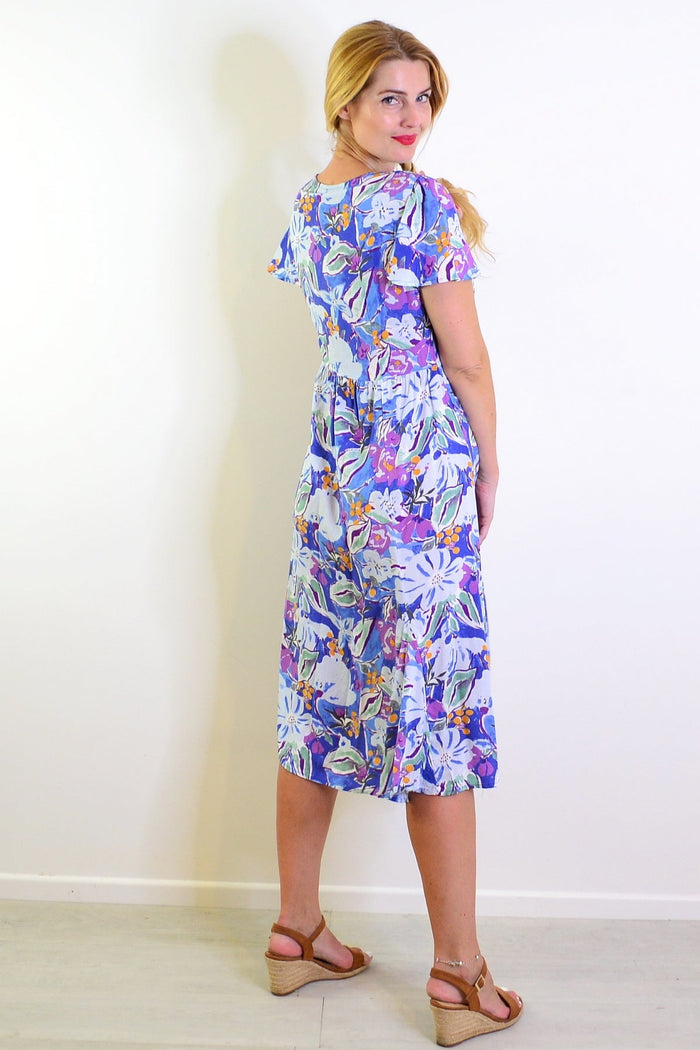 Hourglass summer garden tunic dress featuring a floral pattern, lightweight fabric, and a relaxed fit perfect for warm weather.