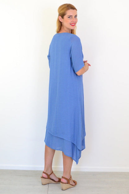 Denim blue summer tunic dress by La Mode displayed on a hanger with a flowy, casual style and sleeveless design.