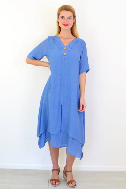 Blue denim summer tunic dress by La Mode with short sleeves and relaxed fit, displayed on a hanger against a plain background.