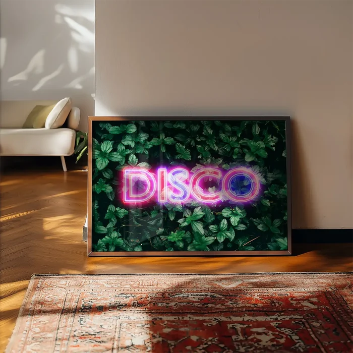 Framed wall art featuring a neon pink DISCO sign glowing against a lush, dark green botanical leaf background.
