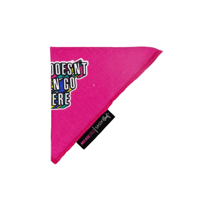 The Sassy Woof Dog Bandana - Mean Girls™ She Doesn't Even Go Here is a bright pink triangle accessory with a black MEAN GIRLS x Sassy Woof tag and colorful "DOESN’T EVEN GO HERE" text—perfect for fashionable pups.