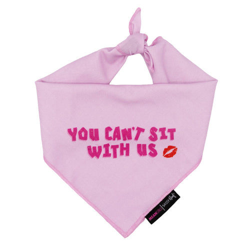 The Sassy Woof Dog Bandana - Mean Girls™ You Can't Sit With Us features bold pink text, a red lipstick kiss, and a black tag—ideal for dog fashion and pairs perfectly with an adjustable harness.
