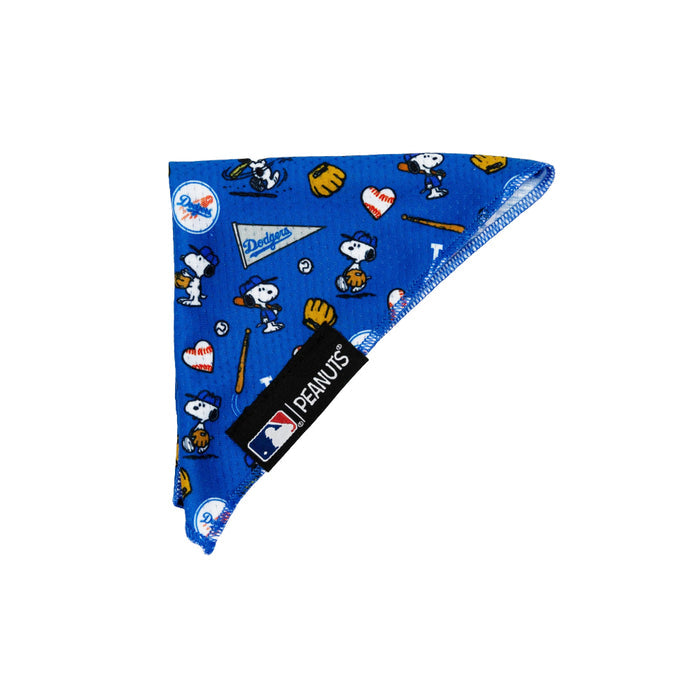 The Sassy Woof Dog Bandana - MLB™ x Peanuts™ Los Angeles Dodgers™ features cooling blue mesh with Snoopy in a Dodgers uniform, bats, gloves, hearts, and team logos. MLB and Peanuts tags are sewn onto this fun pet accessory.