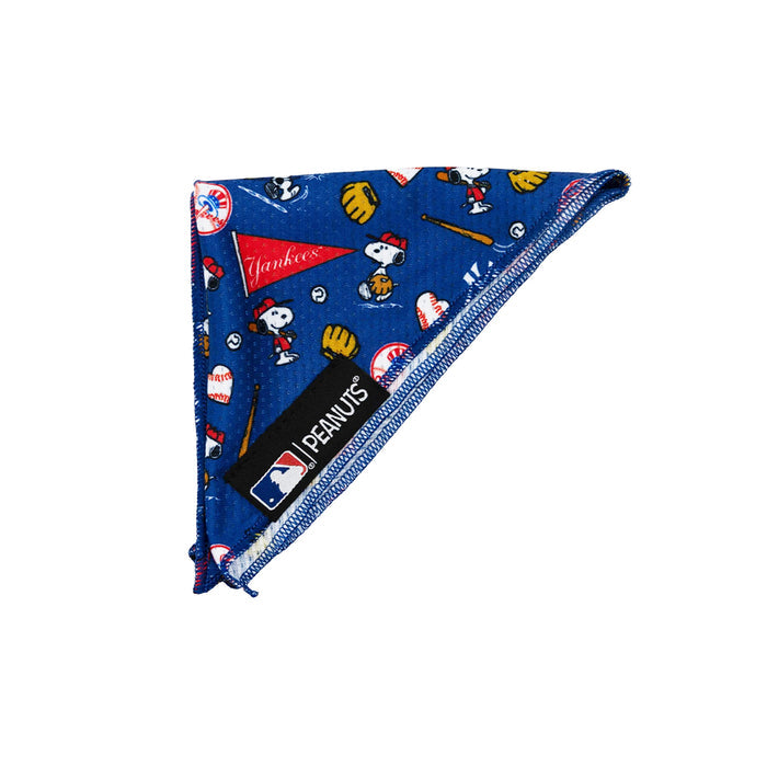 The Sassy Woof Dog Bandana – MLB™ x Peanuts™ New York Yankees™ features playful Yankees, Snoopy, and MLB logos with baseball gear. This stylish accessory displays vibrant designs and brand tags when worn.