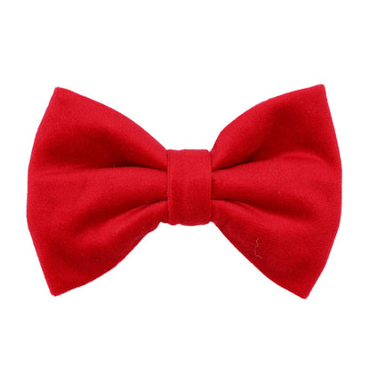The Sassy Woof Dog Bowtie - Naughty features a bright red velvet, classic symmetrical shape—ideal for pairing with holiday dog collars or festive harnesses. Shown isolated on a white background.