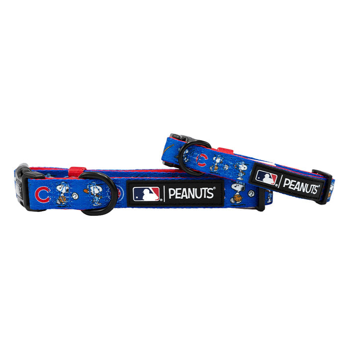 Two Sassy Woof Dog Collar - MLB™ x Peanuts™ Chicago Cubs™, featuring Snoopy, Woodstock, and the MLB Peanuts logo tag. Each adjustable collar has black plastic buckles and sturdy straps for a secure fit.