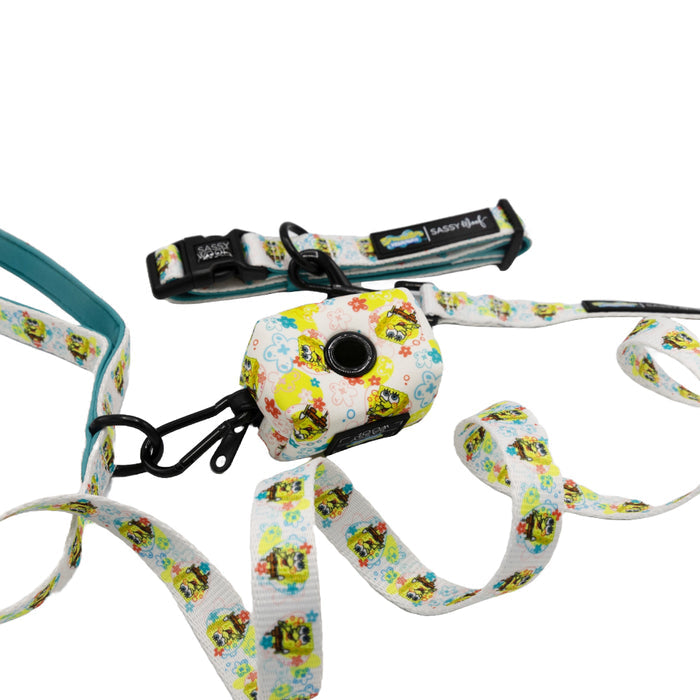 The Sassy Woof Dog Collar Three Piece Bundle - SpongeBob SquarePants™ Bikini Bottom features a vibrant cartoon print and includes a matching collar, leash, and waste bag holder, all displayed on a white background.