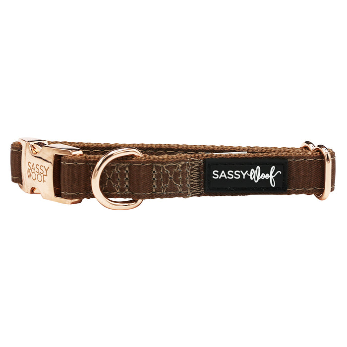 A Dog Collar Three Piece Bundle - Teddy by Sassy Woof, featuring brown material with gold hardware, a D-ring, and a black "SASSY Woof" label in white text, is displayed on a white background.