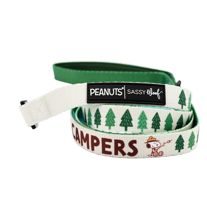 The Sassy Woof Dog Four Piece Bundle - Peanuts™ Beagle Scouts features a forest-themed leash with Snoopy as a ranger, “CAMPERS,” and Peanuts tags—ideal to pair with other Snoopy pet accessories or a Peanuts dog collar.