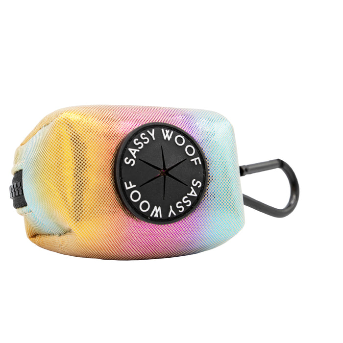 Sassy Woof’s Dog Four Piece Bundle - The Night Life includes a pastel tie-dye waste bag holder with a black circular dispenser, SASSY WOOF label, and a black clip for your leash or harness.