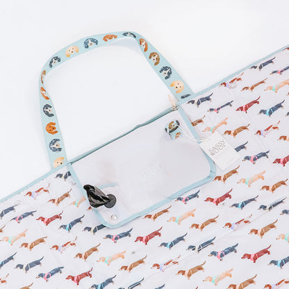 Carry your Sassy Woof Dog Picnic Blanket - Dainty Dachshunds in style with this playful tote, featuring a colorful dachshund pattern, handle dog face print, a handy pocket, and a “Sassy Woof” tag—perfect for outdoor adventures.
