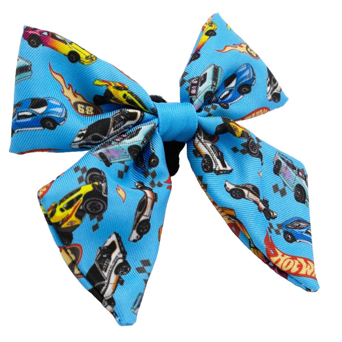 The Sassy Woof Dog Sailor Bow - Hot Wheels™ features colorful toy cars and flames—a perfect match for Hot Wheels-themed dog harnesses or collars.