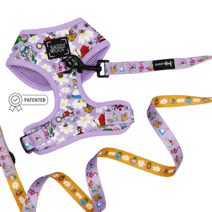 The Sassy Woof Dog Two Piece Bundle in purple features an adjustable harness with playful cartoon characters inspired by Alice in Wonderland.