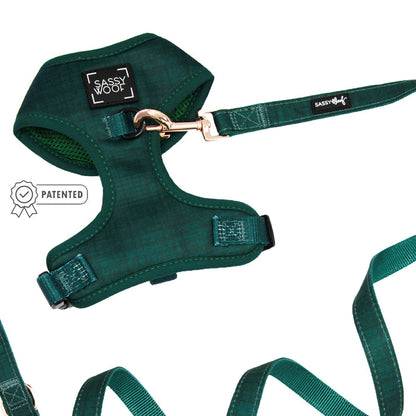 The Sassy Woof Dog Two Piece Bundle - Forest, featuring an adjustable harness and leash with metal clip, is shown against a white background. A patented symbol highlights it as ideal for the puppy growth pawtection plan.