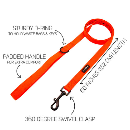 The Sassy Woof Dog Two Piece Bundle in Neon Orange features a 60-inch leash with padded handle, sturdy D-ring, and 360° swivel clasp, pairing perfectly with a matching harness for safety and style. Labeled features highlighted by arrows and text.