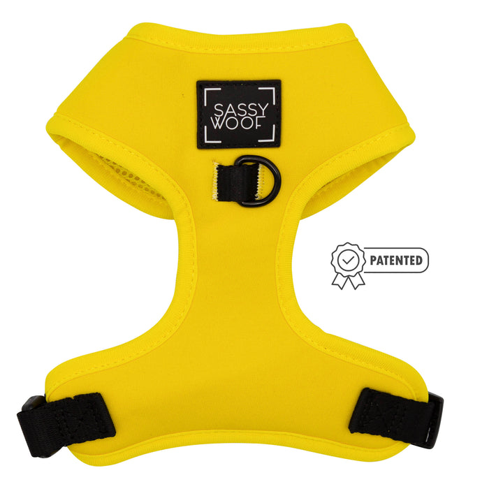 The Sassy Woof Dog Two Piece Bundle - Neon Yellow features a bright, adjustable neon harness with black straps, a black metal D-ring, “Sassy Woof” front label, small "Patented" badge—perfect for your puppy’s growth.