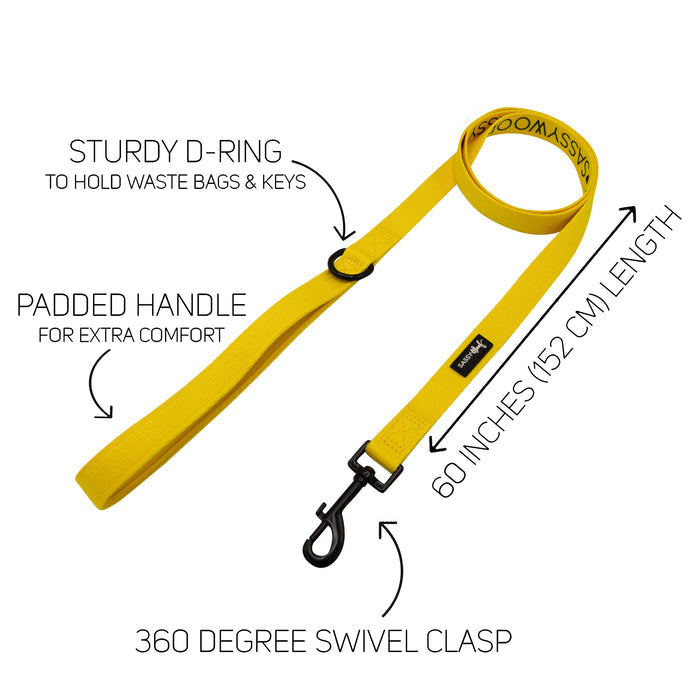 The Sassy Woof Dog Two Piece Bundle - Neon Yellow features a 60-inch leash with padded handle, sturdy D-ring, and 360° swivel clasp. Pair with the adjustable harness to support your puppy's growth. Text and arrows highlight each feature.