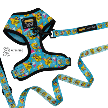 A blue adjustable harness from Sassy Woof’s Dog Two Piece Bundle - Nickelodeon CatDog™ collection, featuring yellow cartoon CatDog characters.